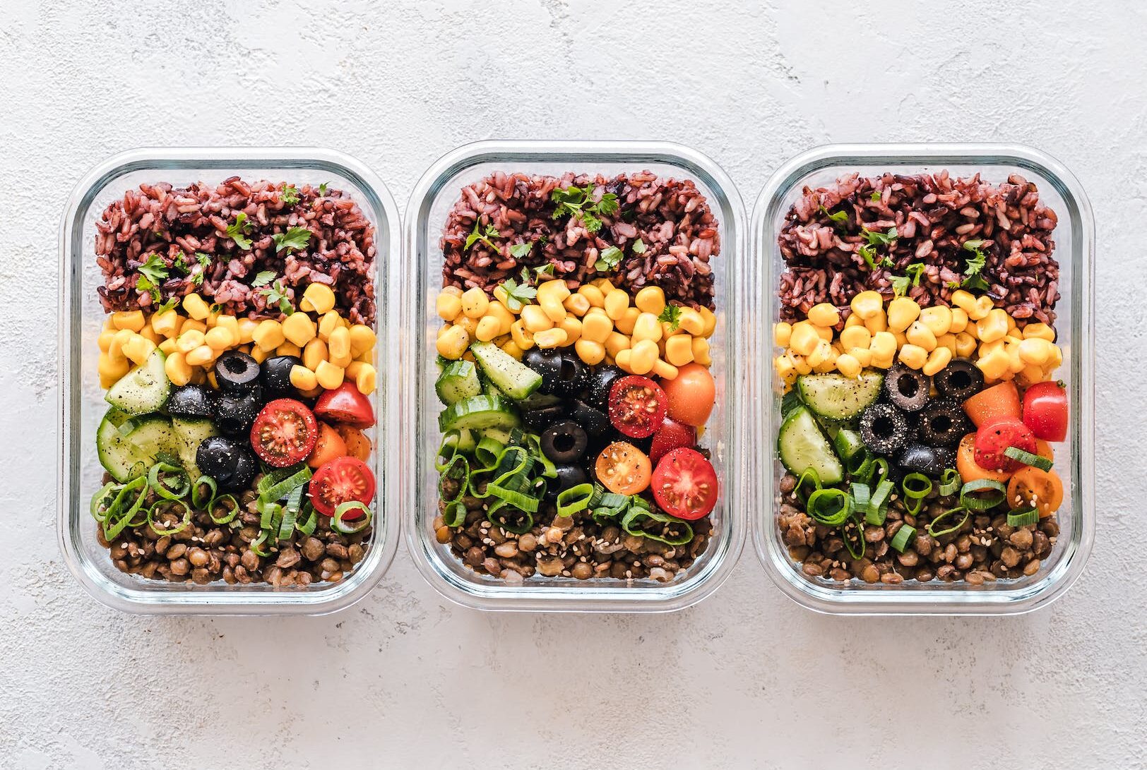 flat lay photography of three tray of foods