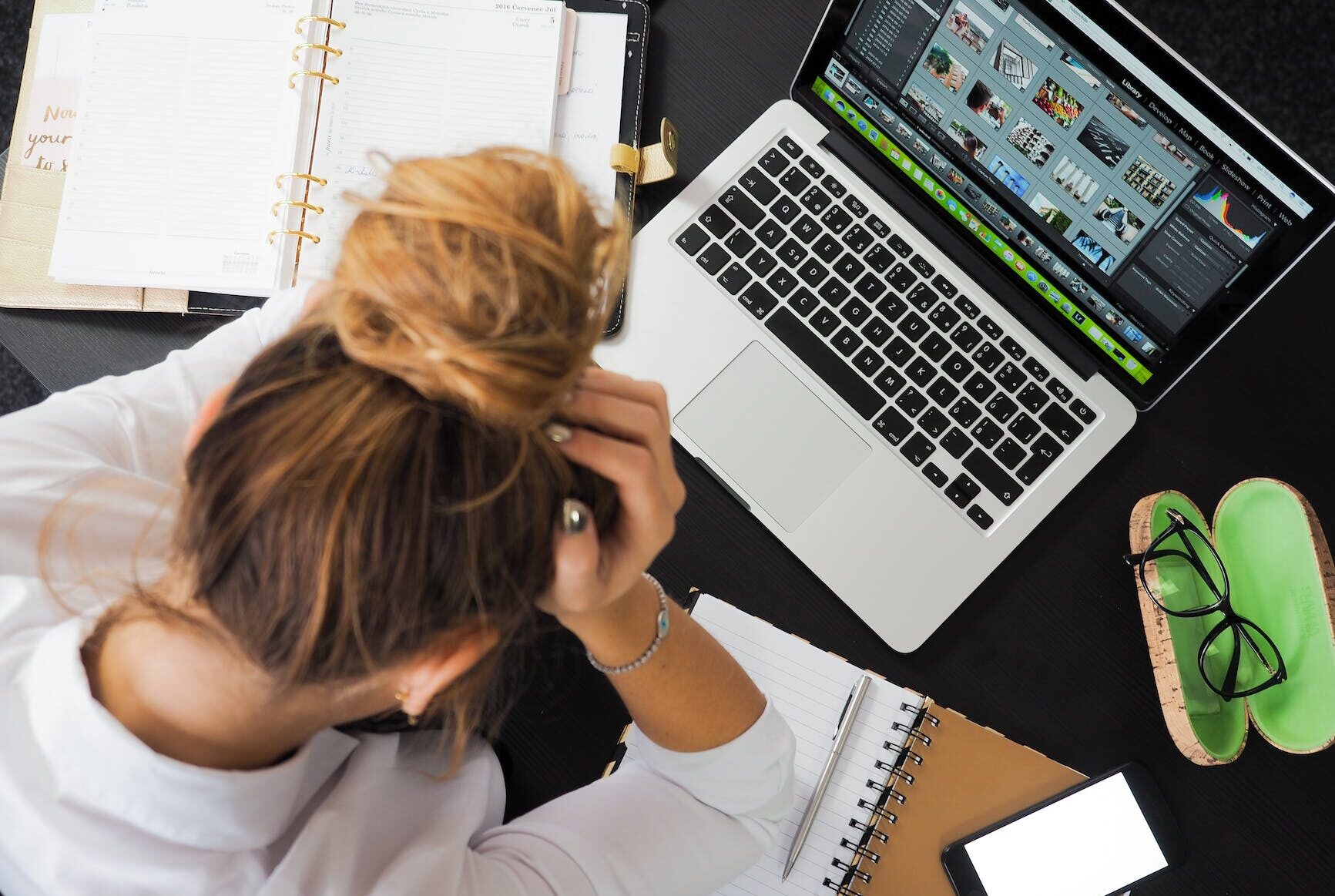 woman sitting in front of macbook